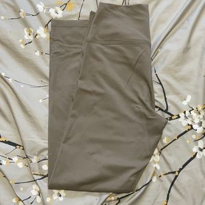 TNA Aritzia tan thick leggings.